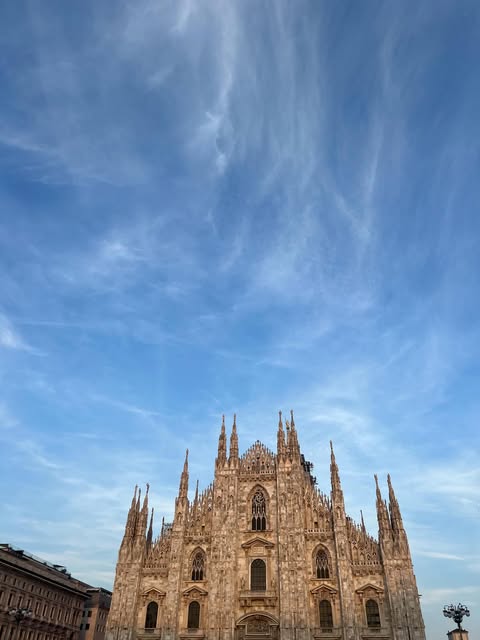Milan’s Duomo beneath a blue sky